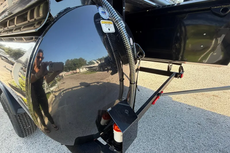 Slide: The Image of Reflection on a shiny black surface of a 2027 Ranger 220FC vehicle. - 27