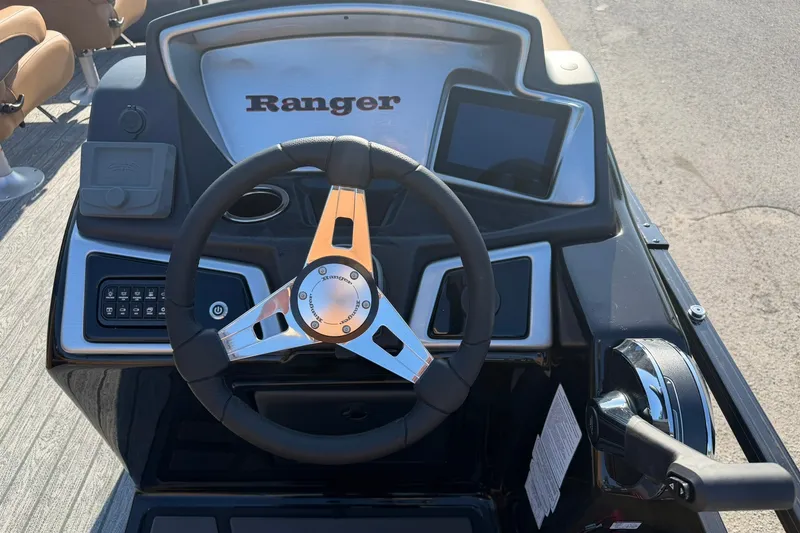Slide: The Image of Steering console of 2027 Ranger 220FC boat with modern controls and display. - 12