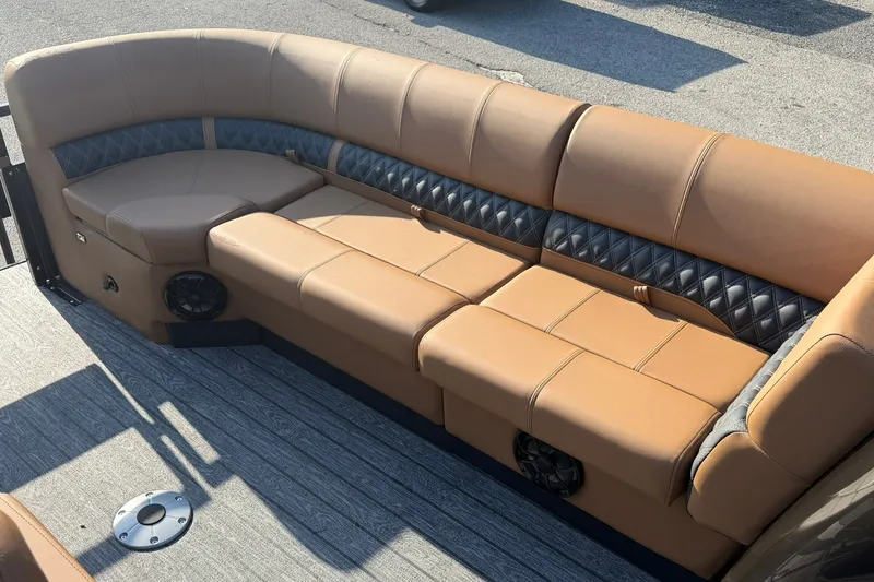 Slide: The Image of Luxurious seating on 2027 Ranger 220FC boat with tan upholstery and diamond-pattern accents. - 8