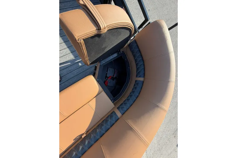Slide: The Image of Brown leather seating on 2027 Ranger 220FC boat, showcasing storage compartment. - 9