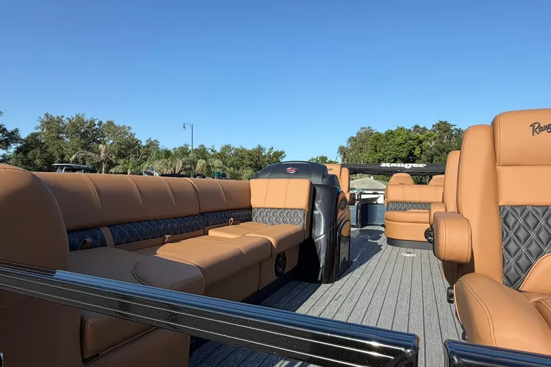 Slide: The Image of Luxurious 2027 Ranger 220FC boat interior with tan leather seating and sleek design. - 4