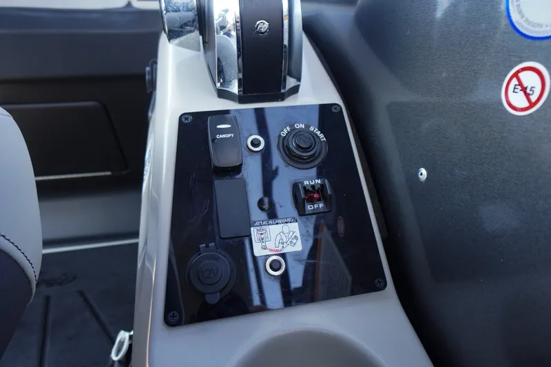 Slide: The Image of Control panel of 2024 Barletta Cabrio 22UC boat with switches and ignition. - 34