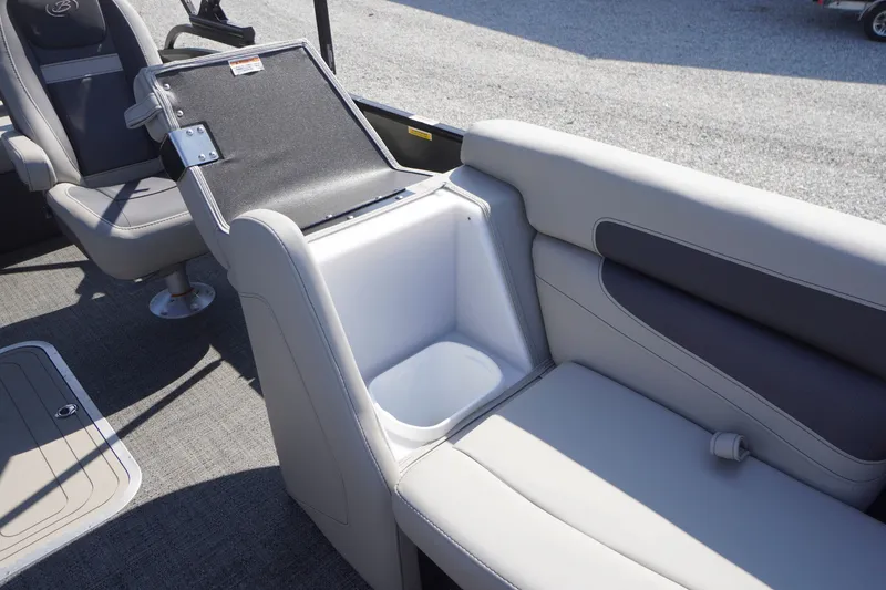 Slide: The Image of 2024 Barletta Cabrio 22UC boat interior with seating and storage compartment. - 9