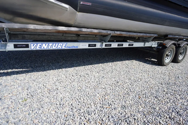 Slide: The Image of Trailer for 2024 Barletta Cabrio 22UC on gravel surface. - 54