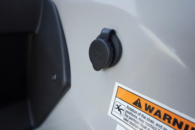 Slide: The Image of 2024 Barletta Cabrio 22UC AUX USB port and warning label detail. - 21