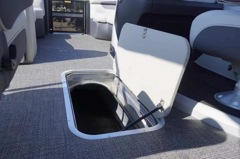 Slide: The Image of 2024 Barletta Cabrio 22UC pontoon boat with open storage compartment on deck. - 36