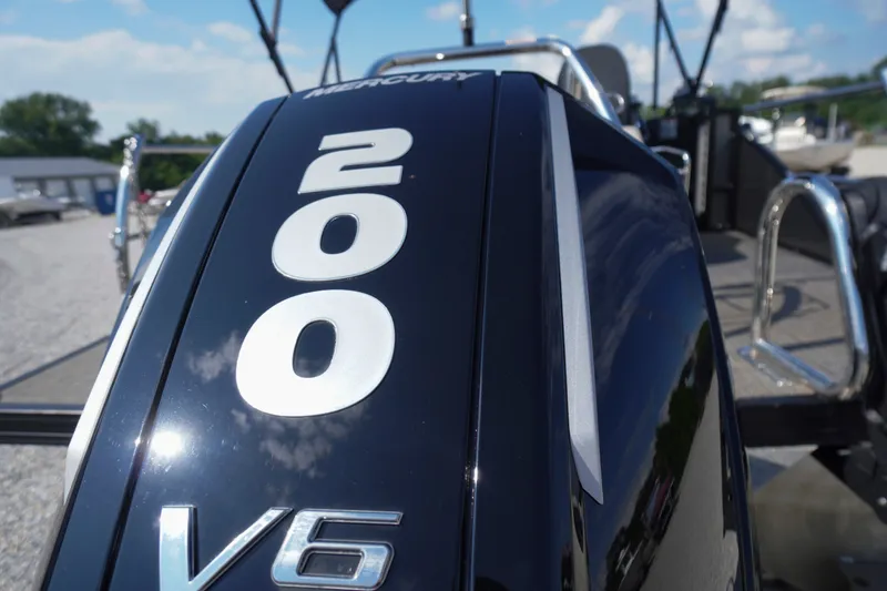 Slide: The Image of Close-up of a Mercury 200 V6 engine on a 2024 Barletta Cabrio 22UC boat. - 49