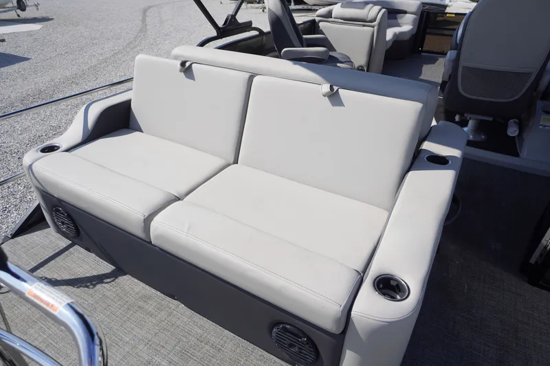Slide: The Image of 2024 Barletta Cabrio 22UC boat interior with comfortable seating and cup holders. - 40