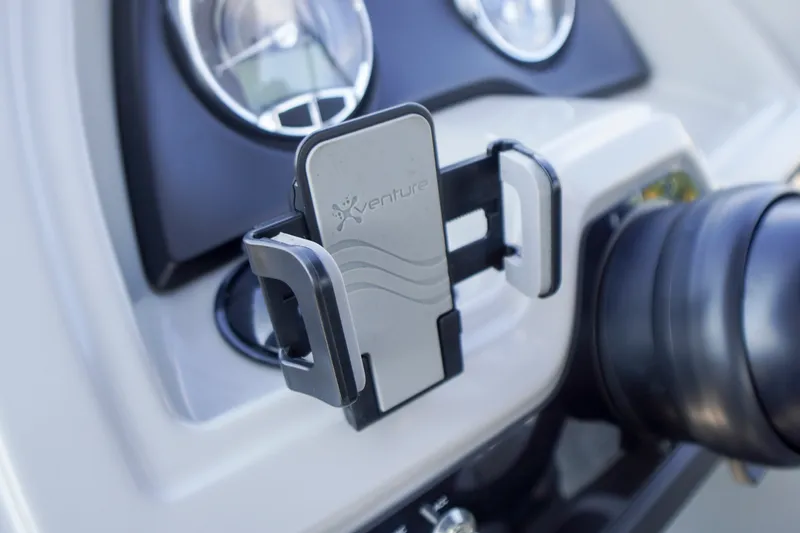 Slide: The Image of Phone holder on 2024 Barletta Cabrio 22UC dashboard, featuring Xventure branding. - 17