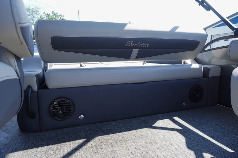 Slide: The Image of 2024 Barletta Cabrio 22UC boat interior seating with speakers and elegant upholstery. - 37