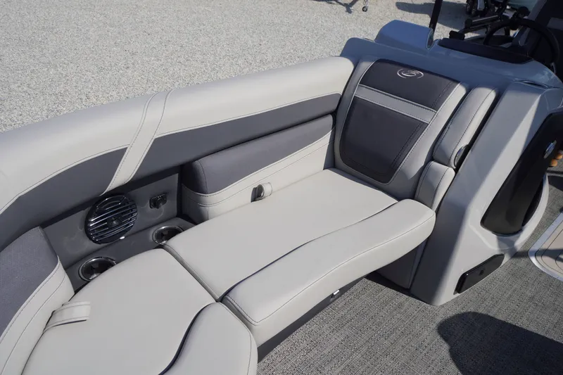 Slide: The Image of 2024 Barletta Cabrio 22UC boat interior with plush seating and cup holders. - 7