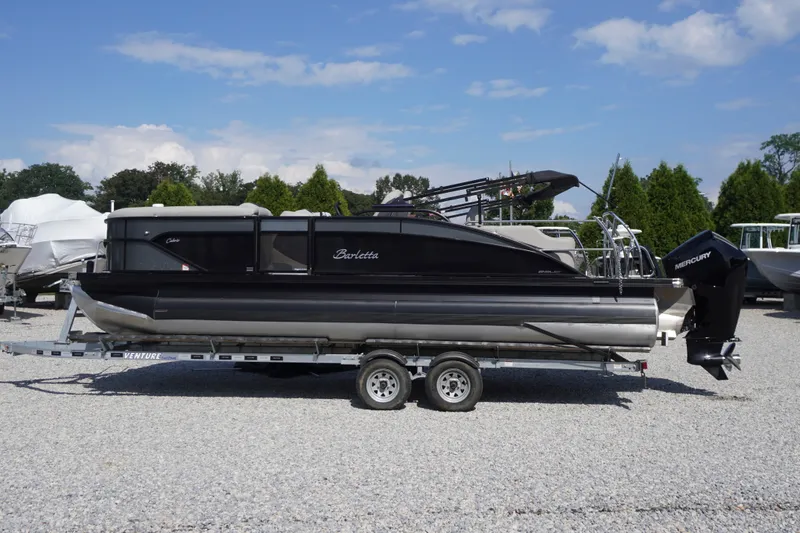 Slide: The Image of 2024 Barletta Cabrio 22UC pontoon boat on trailer, outdoor display. - 51