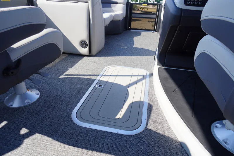 Slide: The Image of 2024 Barletta Cabrio 22UC boat interior with gray flooring and seating. - 35