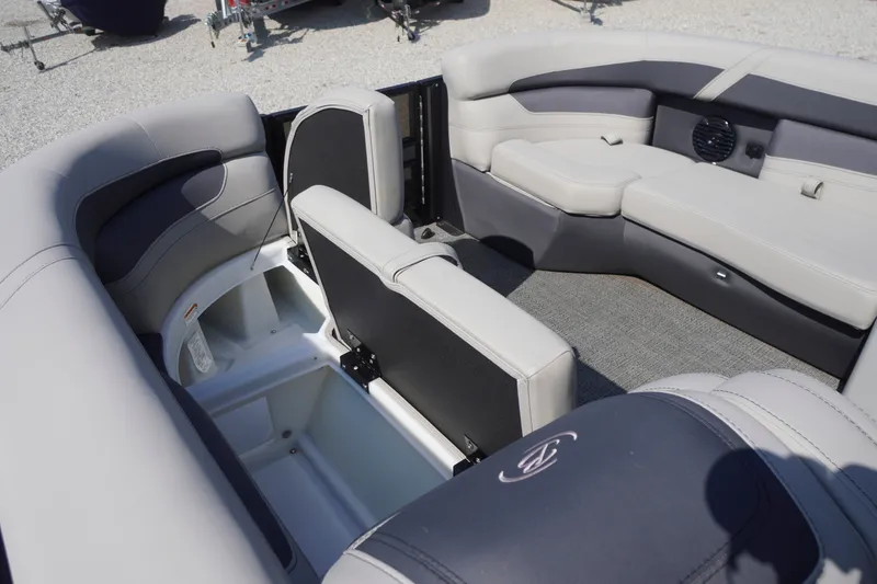 Slide: The Image of 2024 Barletta Cabrio 22UC pontoon boat interior with plush seating and storage compartments. - 10