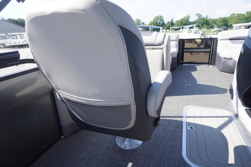 Slide: The Image of 2024 Barletta Cabrio 22UC boat interior with gray seating and carpet flooring. - 28