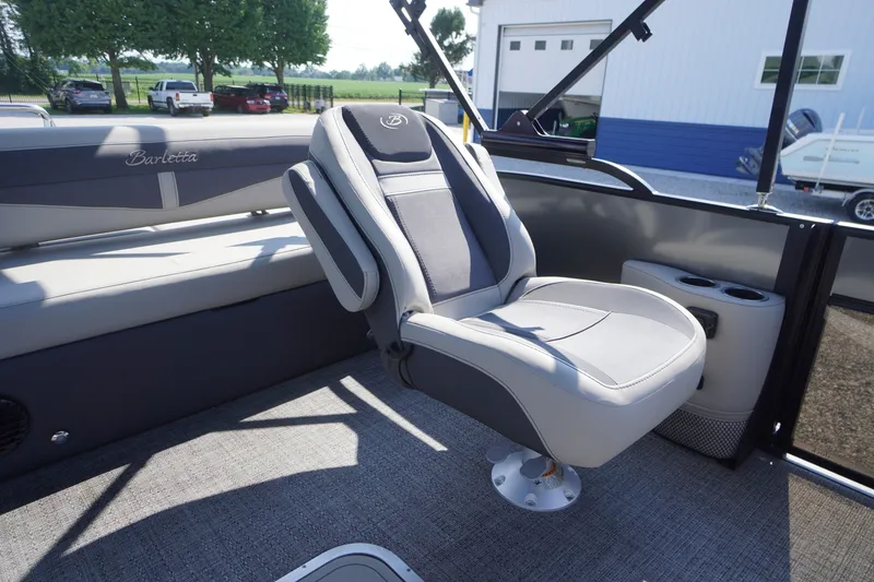 Slide: The Image of 2024 Barletta Cabrio 22UC boat interior with plush seating and modern design. - 31