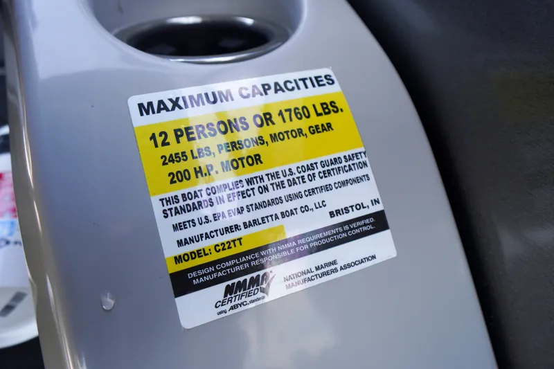 Slide: The Image of 2024 Barletta Cabrio 22UC capacity label, 12 persons or 1760 lbs, 200 HP motor. - 22