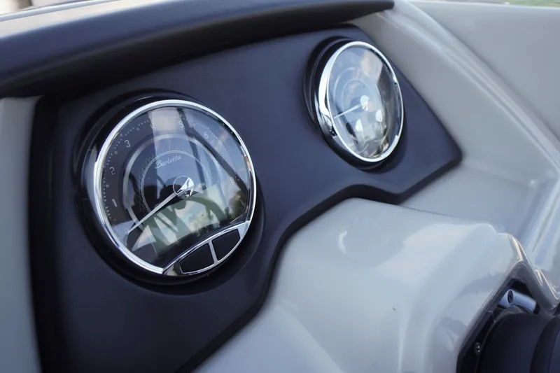 Slide: The Image of Dashboard of 2024 Barletta Cabrio 22UC boat with chrome-trimmed gauges. - 16