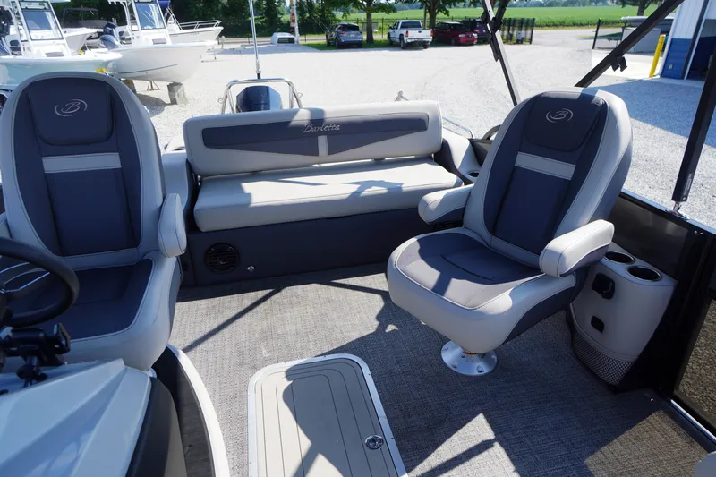Slide: The Image of 2024 Barletta Cabrio 22UC boat interior with plush seating and modern design. - 33