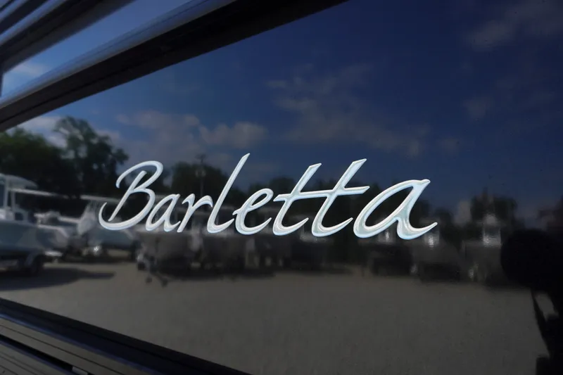 Slide: The Image of Barletta Cabrio 22UC 2024 logo on sleek boat exterior. - 2