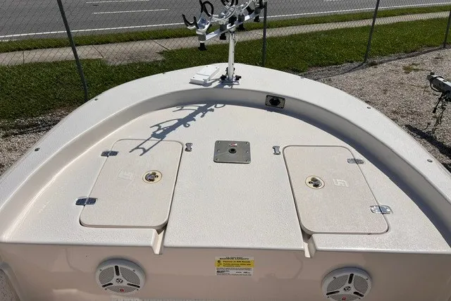 Slide: The Image of 2018 Carolina Skiff 16 JVX CC boat deck with storage compartments and rod holders. - 9