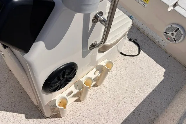 Slide: The Image of 2018 Carolina Skiff 16 JVX CC boat interior with rod holders and speakers. - 8