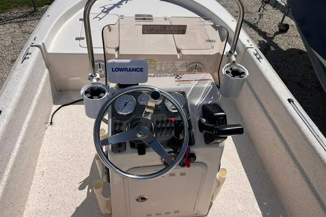 Slide: The Image of 2018 Carolina Skiff 16 JVX CC boat console with steering wheel and Lowrance equipment. - 5