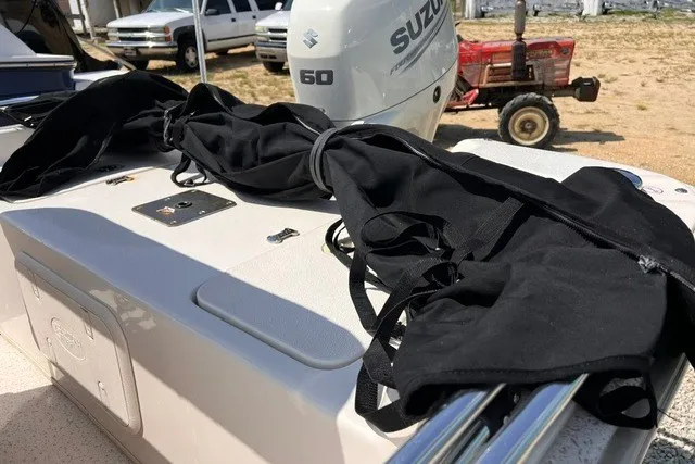 Slide: The Image of 2018 Carolina Skiff 16 JVX CC with Suzuki 60 engine, black cover on deck. - 3