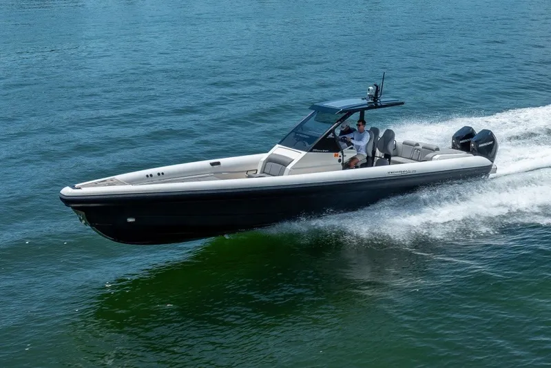 Slide: The Image of 2021 Technohull 38 Grand Sport speedboat cruising on open water. - 20