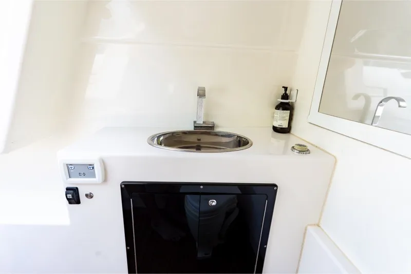 Slide: The Image of Interior sink area of 2021 Technohull 38 Grand Sport boat, featuring modern fixtures. - 42