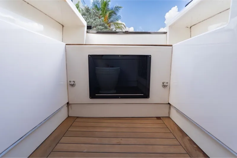 Slide: The Image of Interior of 2021 Technohull 38 Grand Sport boat with wooden flooring and storage compartment. - 41