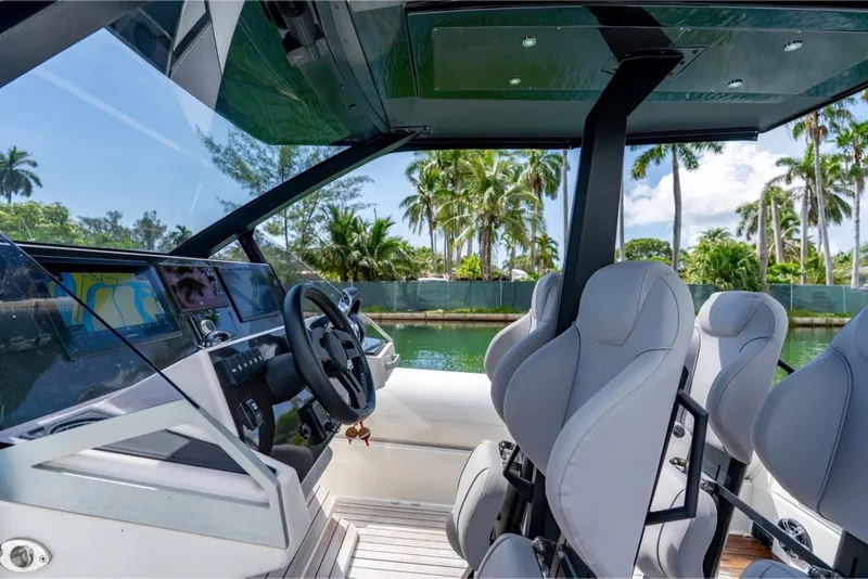 Slide: The Image of Interior of 2021 Technohull 38 Grand Sport boat with modern helm and seating. - 29
