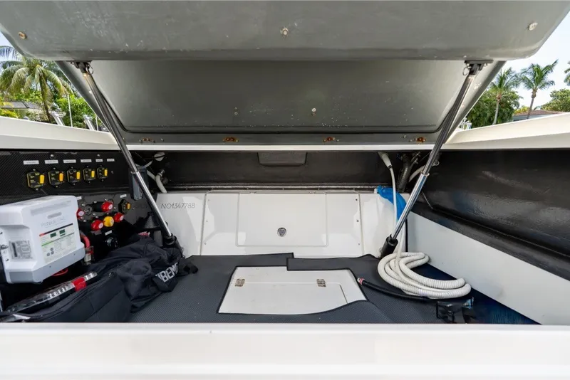 Slide: The Image of 2021 Technohull 38 Grand Sport storage compartment with equipment and wiring. - 37