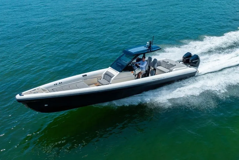 Slide: The Image of 2021 Technohull 38 Grand Sport speedboat cruising on open water. - 19