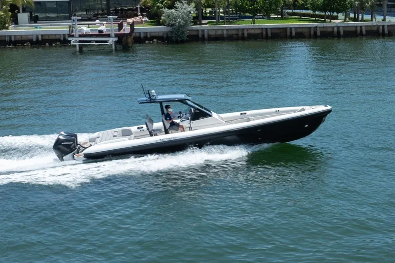 Slide: The Image of 2021 Technohull 38 Grand Sport speedboat cruising on water, side view. - 25