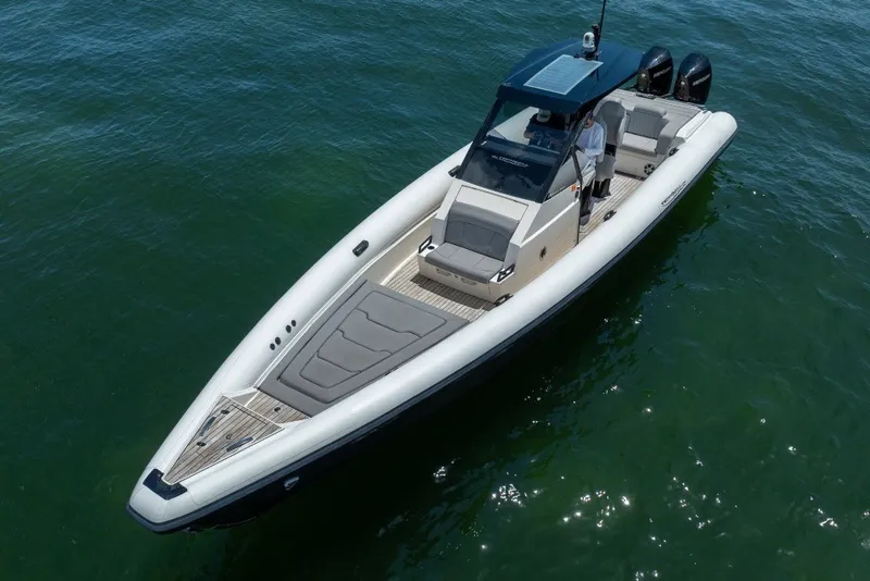 The Image of 2021 Technohull 38 Grand Sport boat on calm water, showcasing sleek design and luxury features. - 5