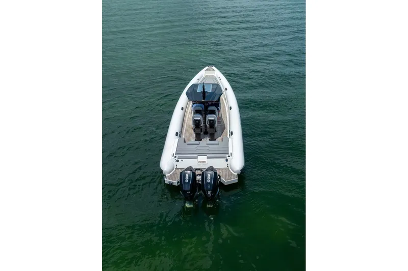 Slide: The Image of 2021 Technohull 38 Grand Sport boat on calm water, aerial view. - 2