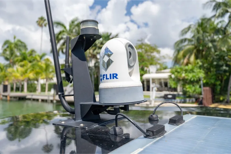 Slide: The Image of FLIR camera on 2021 Technohull 38 Grand Sport, surrounded by tropical scenery. - 40