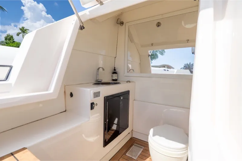 Slide: The Image of Interior of 2021 Technohull 38 Grand Sport boat featuring a compact bathroom. - 43