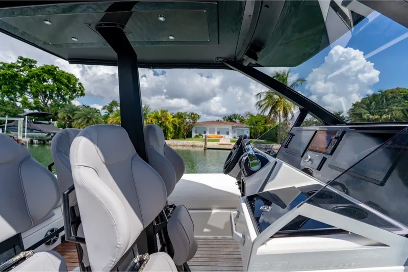 Slide: The Image of 2021 Technohull 38 Grand Sport cockpit with modern controls and luxurious seating. - 34