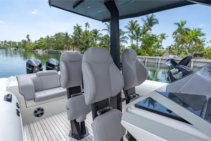 Slide: The Image of 2021 Technohull 38 Grand Sport boat interior with luxury seating and dual Mercury engines. - 35
