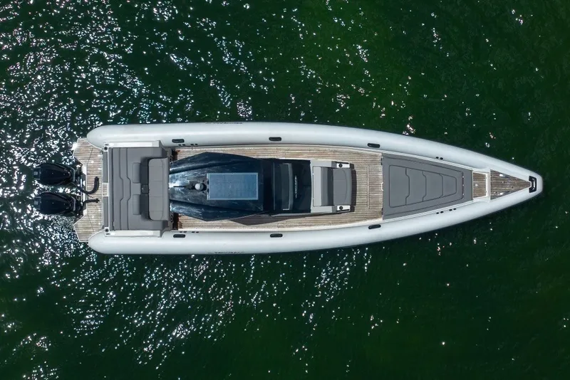 Slide: The Image of Aerial view of 2021 Technohull 38 Grand Sport boat on shimmering water. - 1