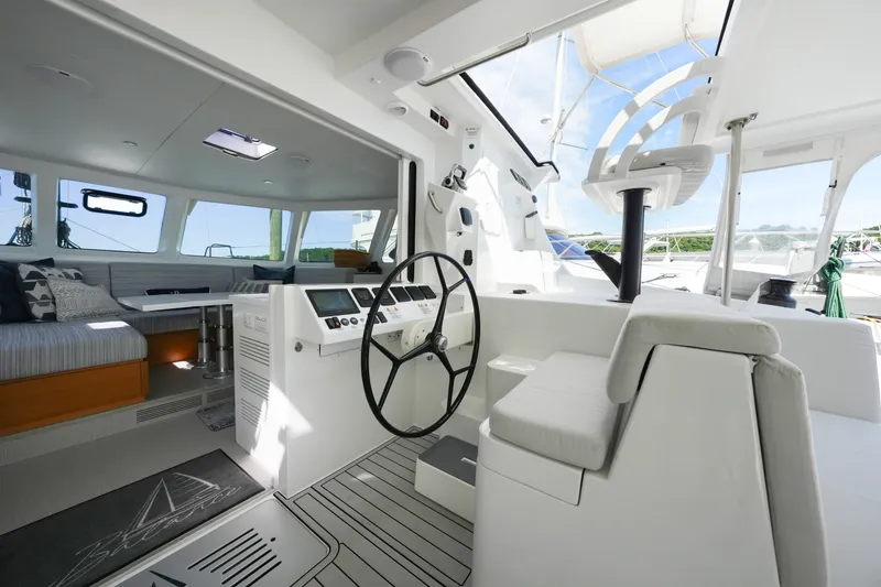 Slide: The Image of Modern interior of 2022 Balance 482 yacht, featuring sleek helm and comfortable seating area. - 13