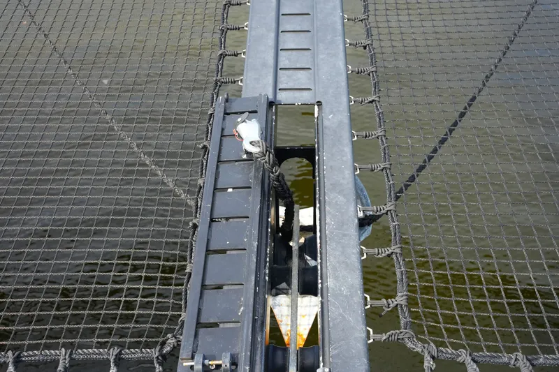 Slide: The Image of Catamaran trampoline netting on a 2022 Balance 482, over calm water. - 64