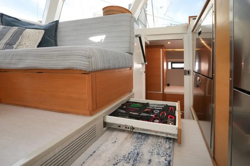 Slide: The Image of Interior of 2022 Balance 482 yacht with tool drawer and modern seating area. - 27