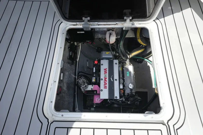 Slide: The Image of Engine compartment of a 2022 Balance 482 boat, featuring a Yanmar engine. - 78