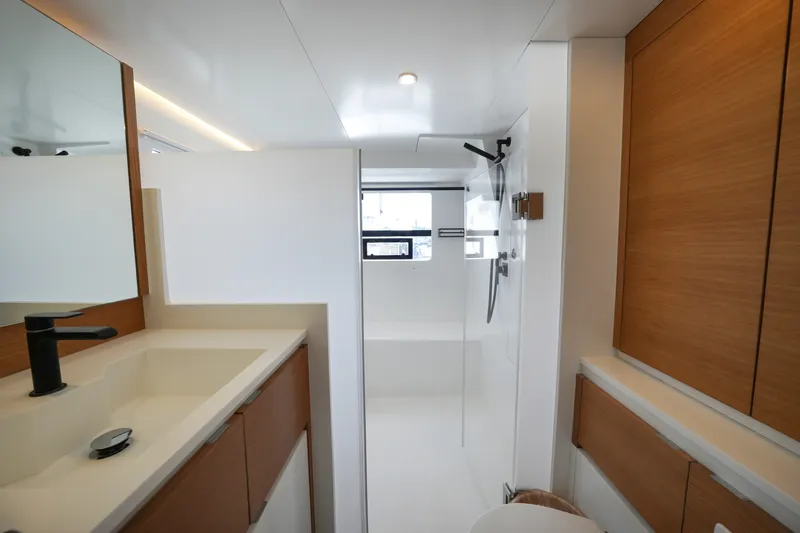 Slide: The Image of Modern bathroom interior in Balance 482 yacht, featuring sleek fixtures and wooden cabinetry, 2022 model. - 53
