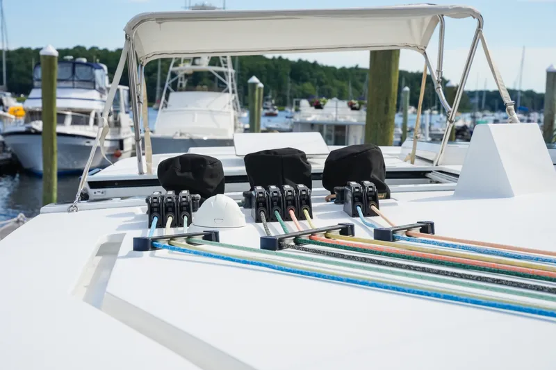 Slide: The Image of Sailing yacht Balance 482, 2022 model, docked with colorful ropes and marina background. - 70