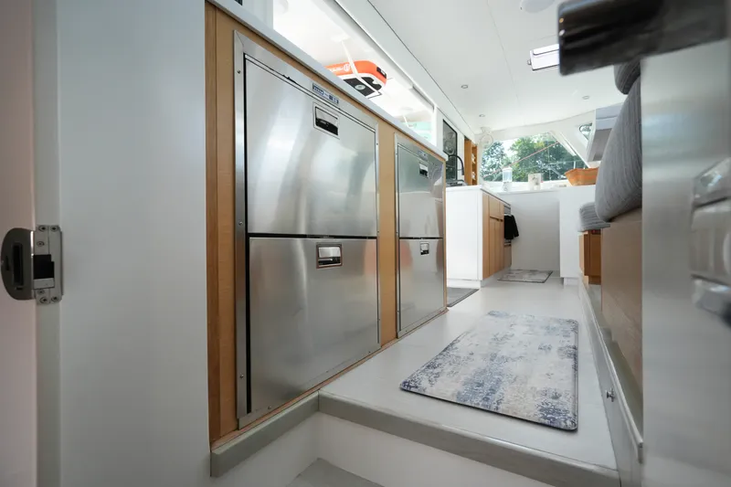 Slide: The Image of Modern kitchen interior on Balance 482 yacht, featuring stainless steel appliances and sleek design, 2022 model. - 29