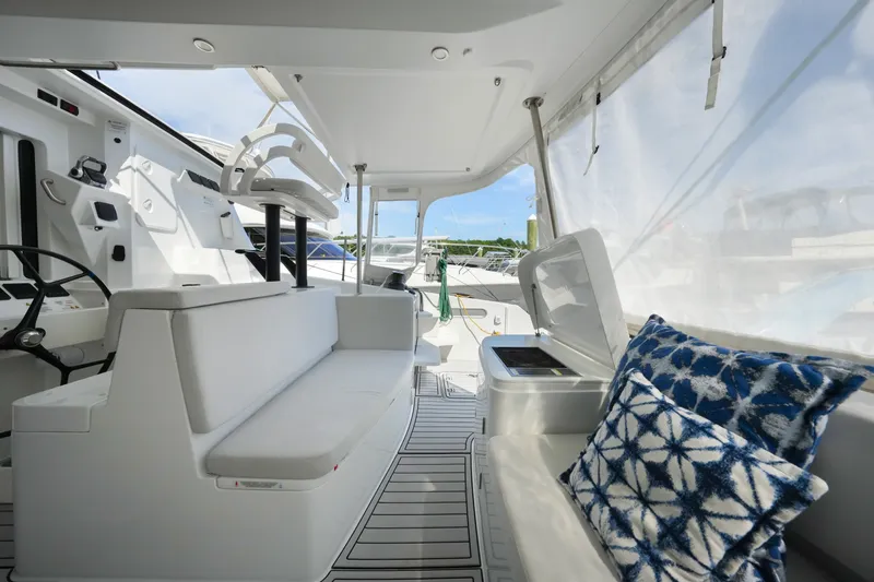 Slide: The Image of Luxurious interior of 2022 Balance 482 yacht with white seating and patterned cushions. - 21